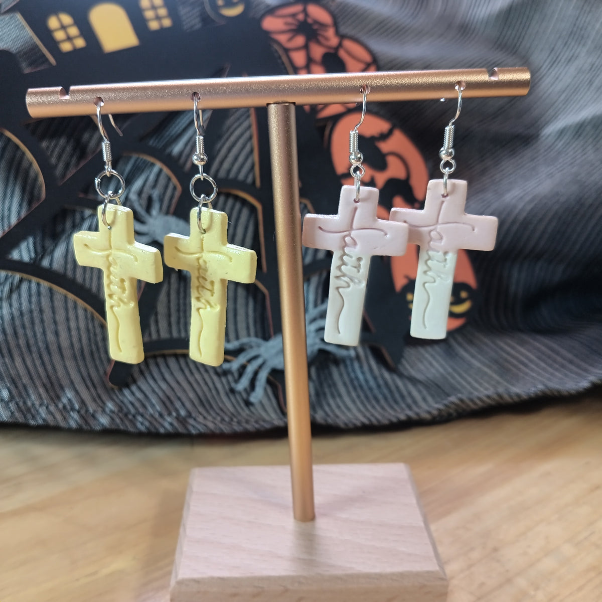 Soft yellow clay cross dangle earrings with embossed Jesus figure