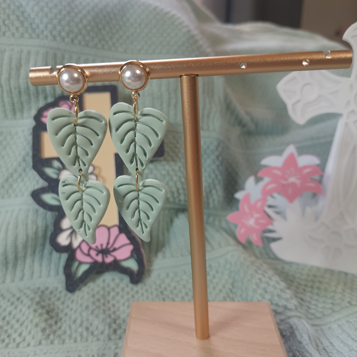 Double-tier sage green monstera leaf clay dangle earrings with pearl stud top and gold connectors