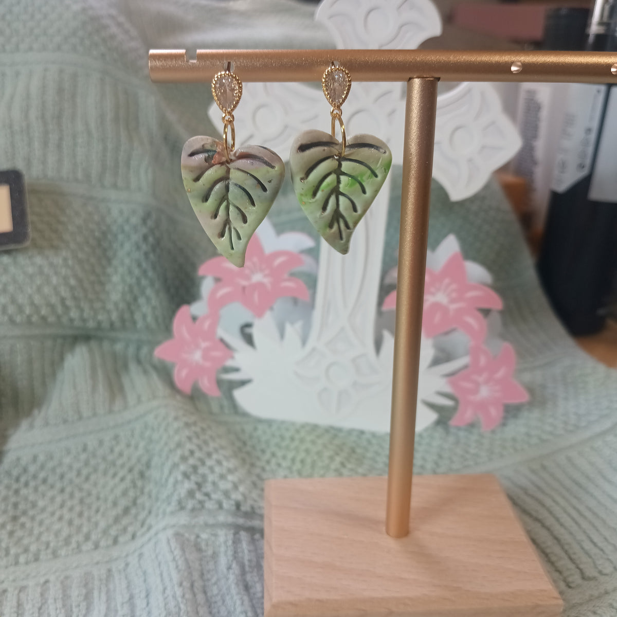 Heart-shaped monstera leaf clay dangle earrings with vein cutouts and gold diamond stud top