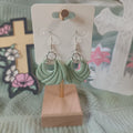 Sage green twisted knot clay hoop dangle earrings with silver hardware