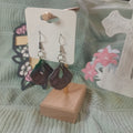 Purple fan shell clay dangle earrings with green edge and teardrop cutout