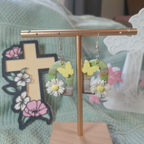 Multicolor clay arch earrings with yellow butterfly and white daisy charms